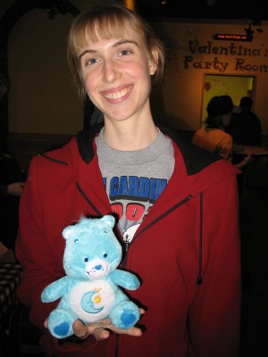 The Missus poses with my Care Bear prize